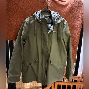 This is a green Vineyard Vines spring anorak rain jacket with a gingham lining